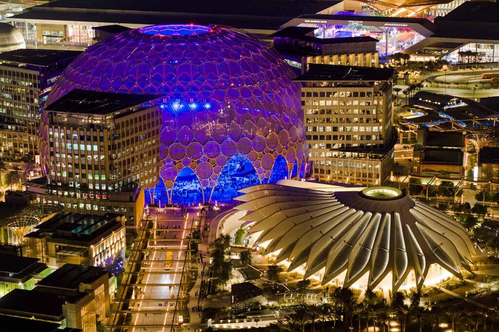 Aerial view at night of Al Wasl Dome and the UAE Pavilion